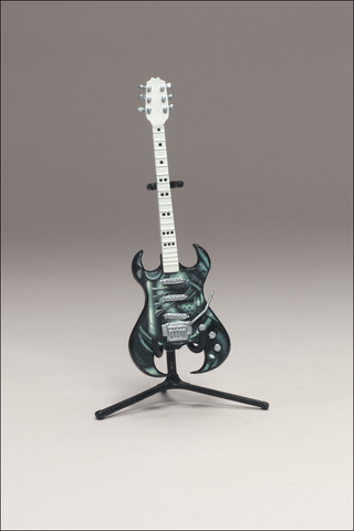 Illustration for article titled McFarlane's Tiny, Plastic Guitar Hero Guitars